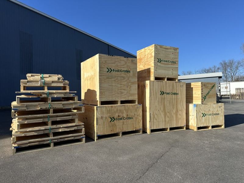 Several assembled Fast Crates plywood crates outside the warehouse